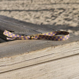 Bandarmband Würfel lila/gelb
