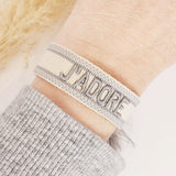 Geweven armband J'adore greige