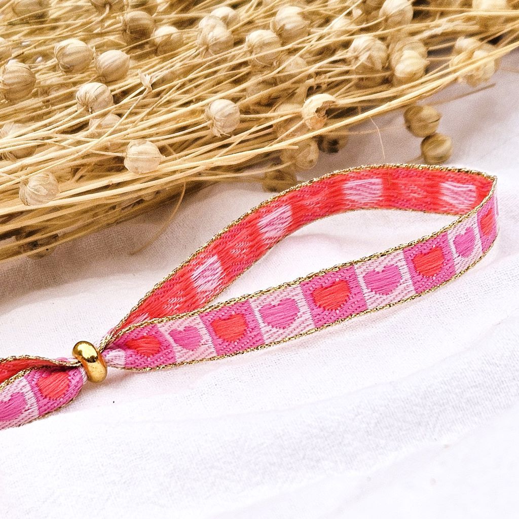 Lint armbandje hartjes roze/rood