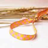 Lint armbandje blokjes geel/roze